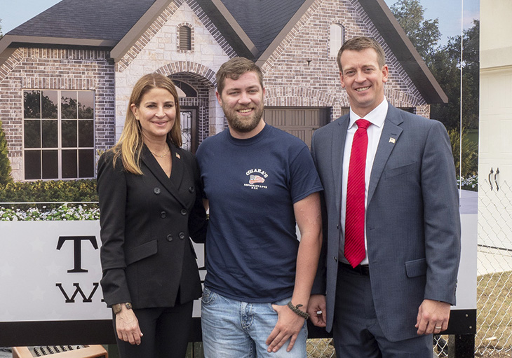 Perry Homes team members Kathy Britton (CEO) and Chris Little (City President) are committed to giving back to veterans like CPL Deatherage by building homes for disabled veterans.