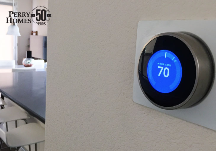 nest thermostat install on a wall in a home with temperature set at seventy degrees