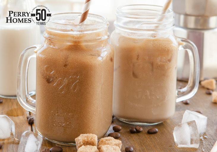 iced coffee in mason jars with a striped straw 