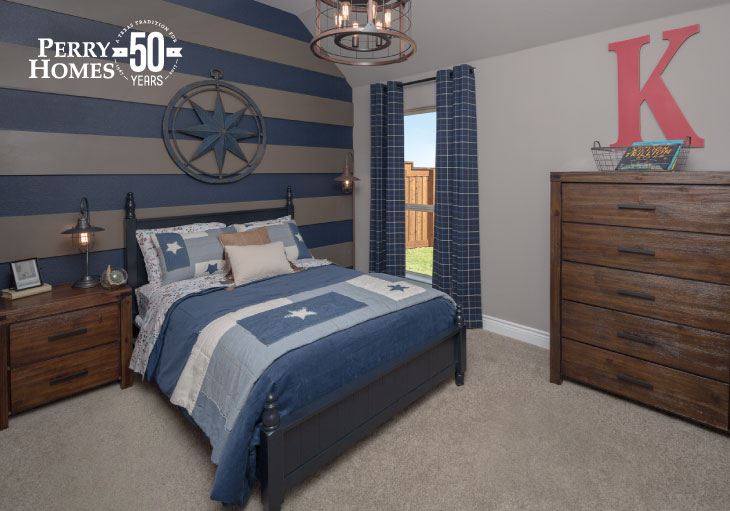guest bedroom with accent wall painted with horizontal stripes in denim blue and dark khaki