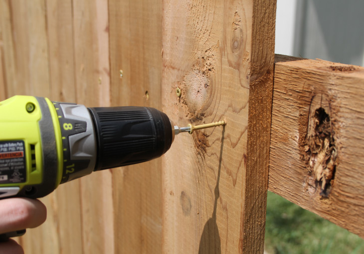 screwing fence picket to cross support