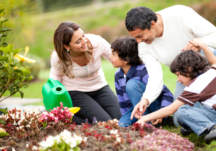 A family enjoying fun spring activities like gardening together
