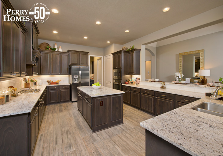 open-concept kitchen with dark wood cabinets, granite countertops, tile backsplash, center island and wood-like tile floor