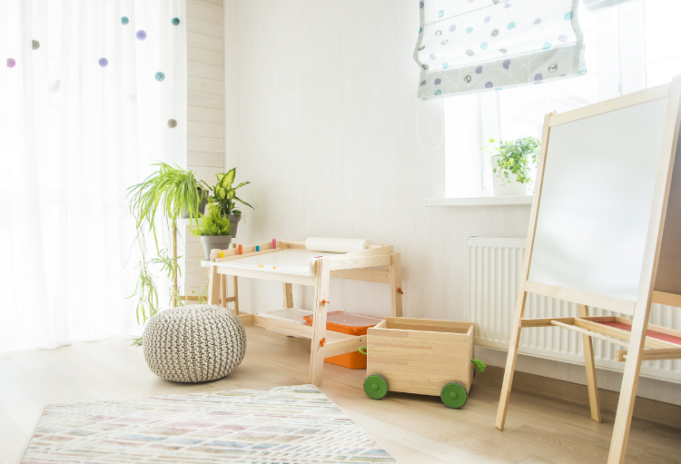 A playroom with plenty of natural light and children’s toys.